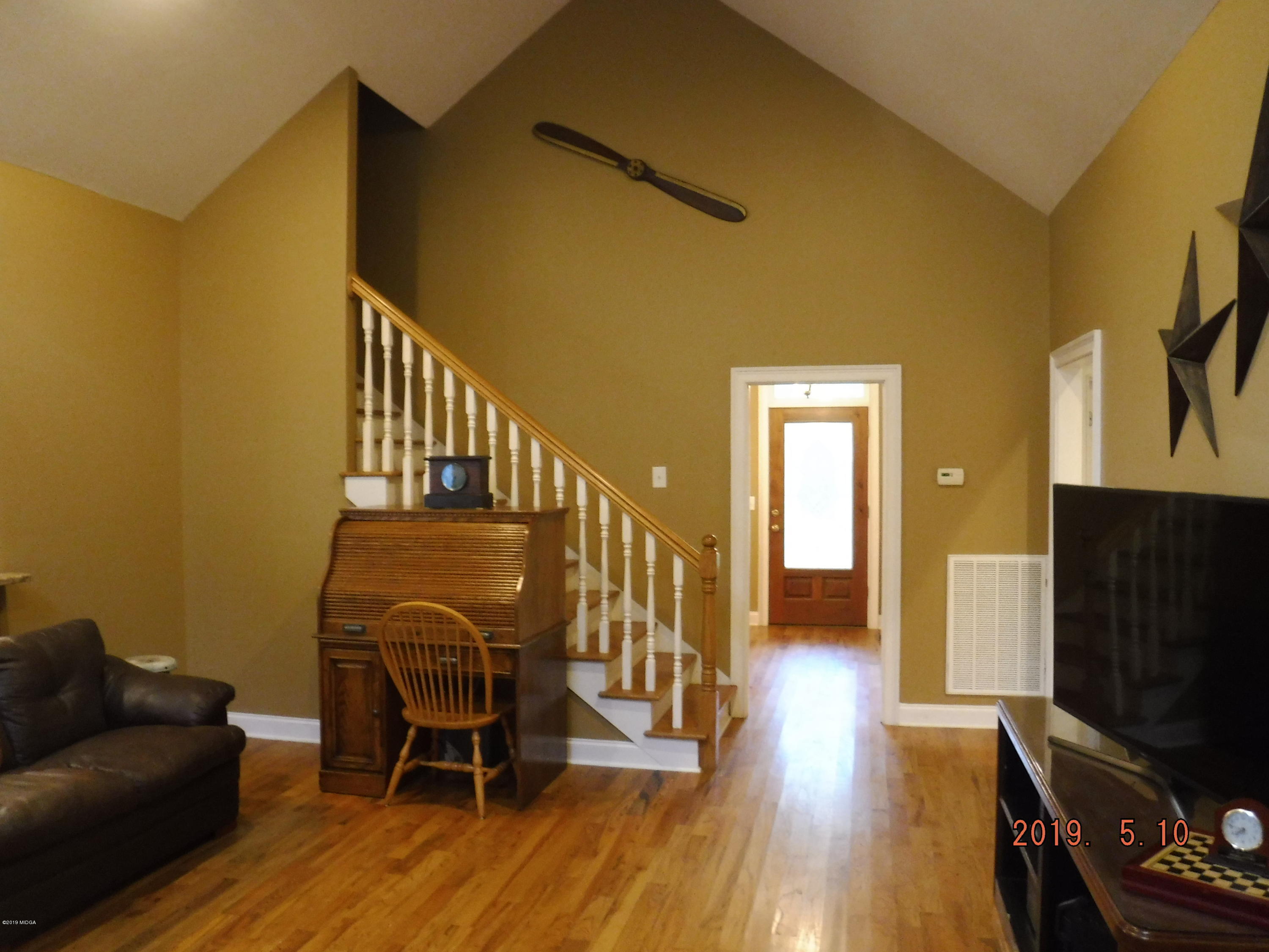 755 Charles Johnson Road Forsyth, GA 31029 - Photo 10 of 35 a view of a livingroom with furniture and a flat screen tv