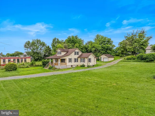 a view of a house with a big yard