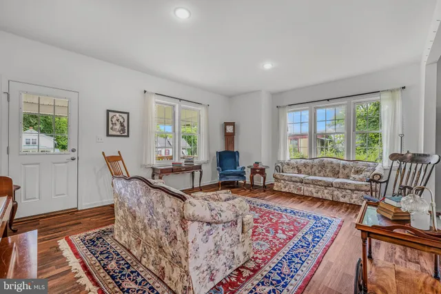 a living room with furniture and a rug