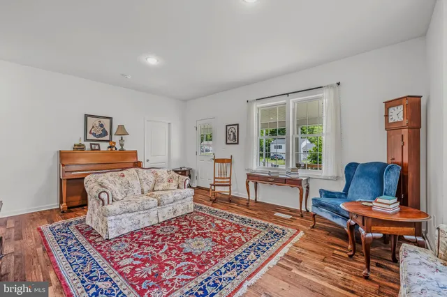 a living room with furniture and a rug