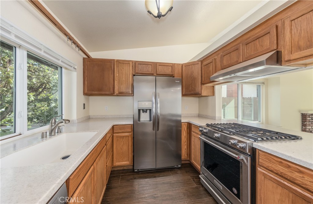 1954 Union Street Colton, CA 92324 - Photo 9 of 32 a kitchen with stainless steel appliances granite countertop a stove a refrigerator and a sink