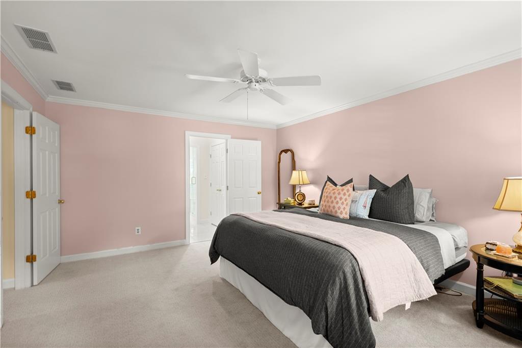 40 Ivy Chase Northeast Atlanta, GA 30342 - Photo 19 of 40 a bedroom with a bed and a ceiling fan