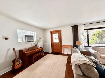 a bedroom with furniture and a window