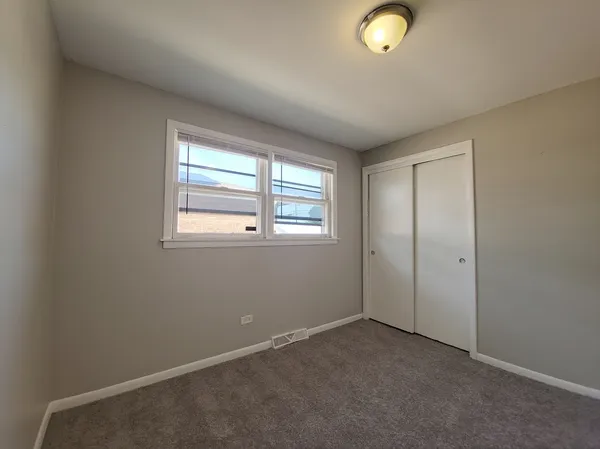 a view of empty room with wooden ceiling