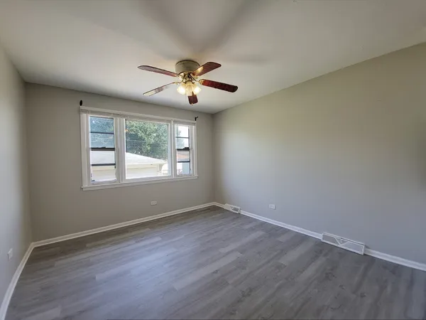 a kitchen with a refrigerator and a sink