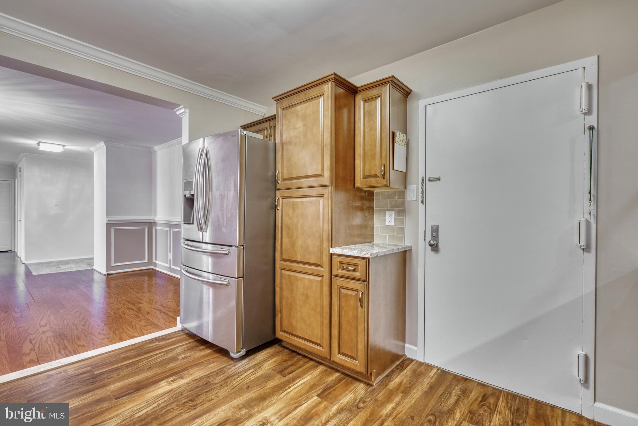 1800 Old Meadow Road, Unit 1006 McLean, VA 22102 - Photo 12 of 63 a kitchen with stainless steel appliances granite countertop a refrigerator and a sink