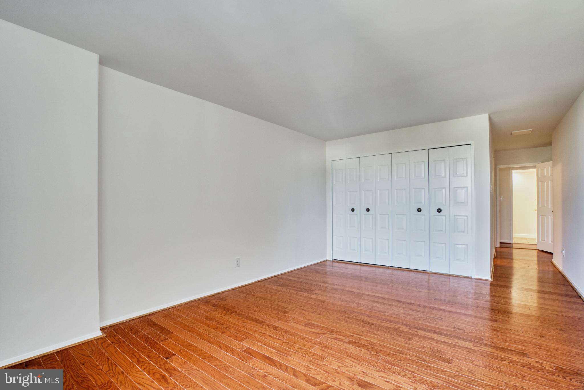 1800 Old Meadow Road, Unit 1006 McLean, VA 22102 - Photo 22 of 63 a big room with wooden floor