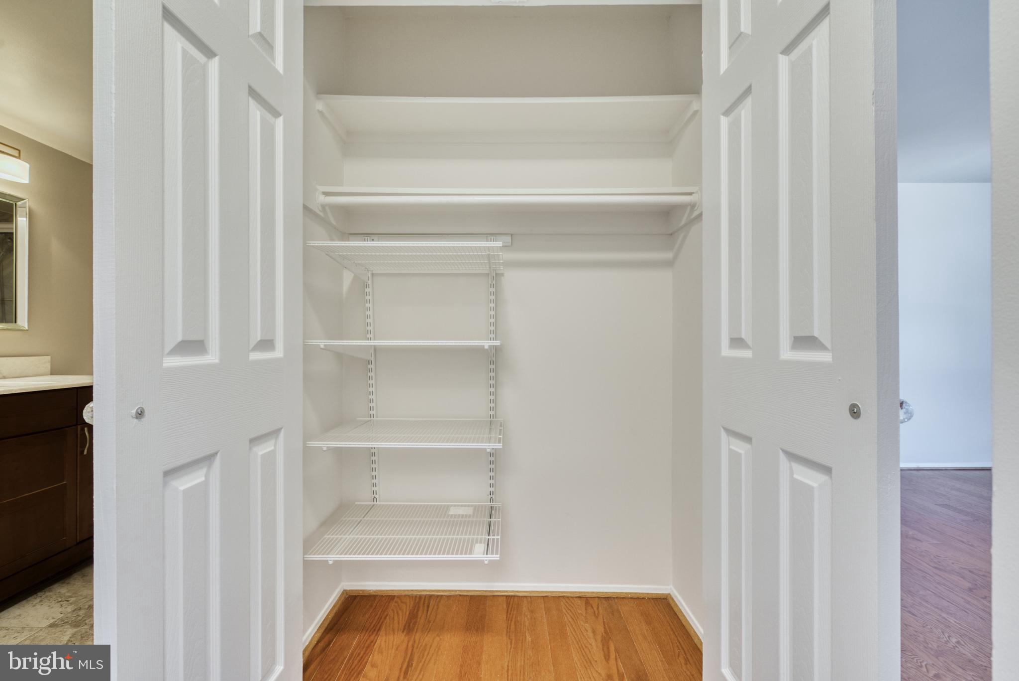 1800 Old Meadow Road, Unit 1006 McLean, VA 22102 - Photo 25 of 63 a view of walk in closet with empty racks