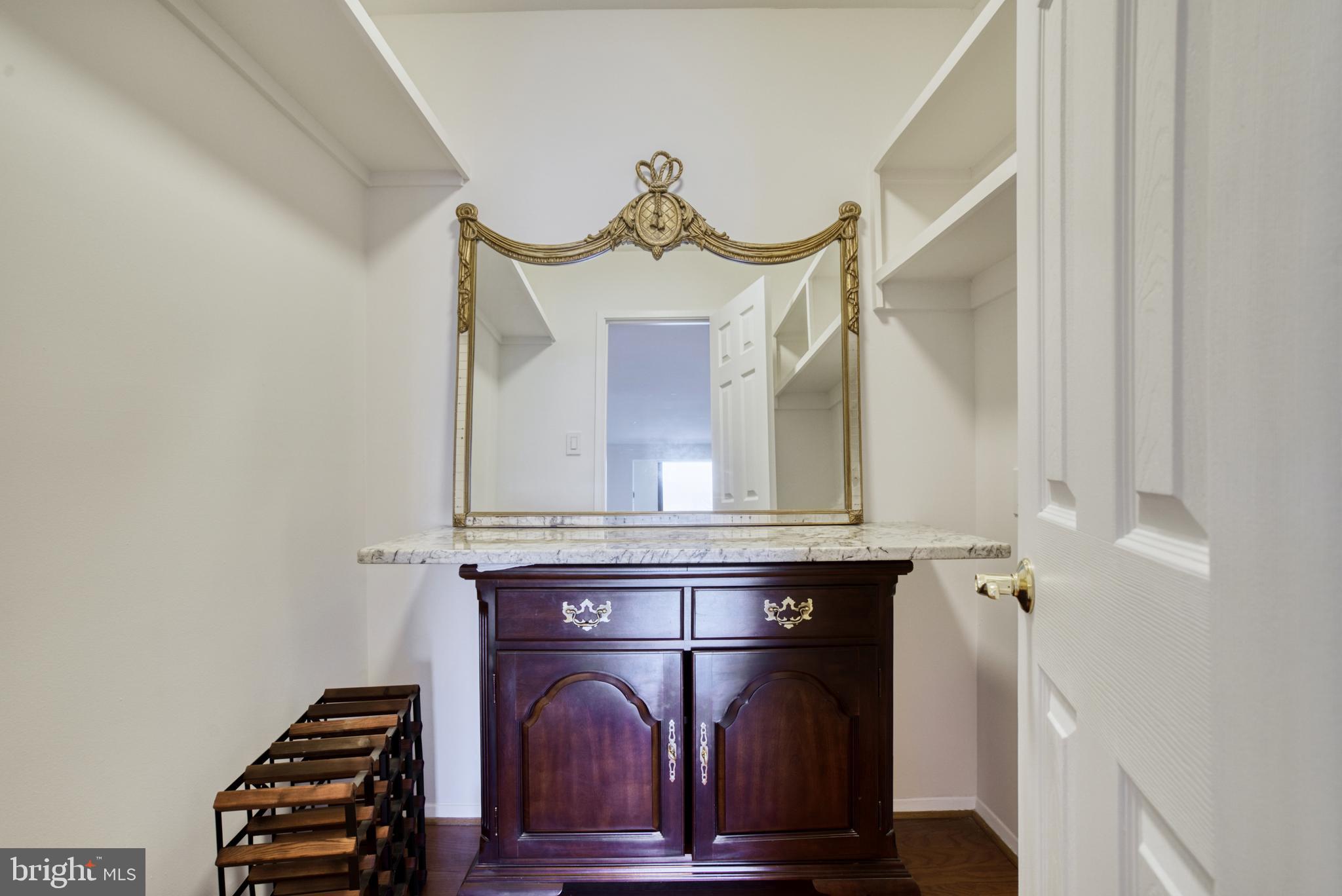 1800 Old Meadow Road, Unit 1006 McLean, VA 22102 - Photo 26 of 63 a fireplace with a vase on top of it