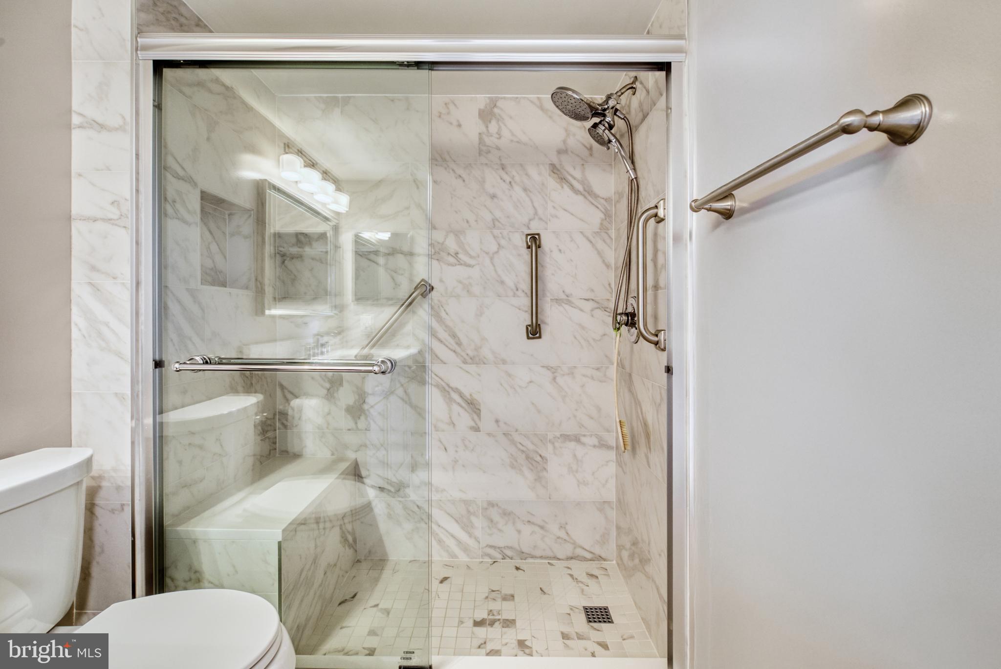 1800 Old Meadow Road, Unit 1006 McLean, VA 22102 - Photo 32 of 63 a bathroom with a shower and toilet