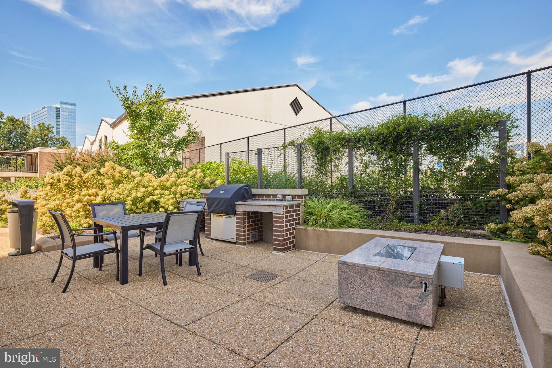 1800 Old Meadow Road, Unit 1006 McLean, VA 22102 - Photo 48 of 63 a view of a patio with a table and chairs