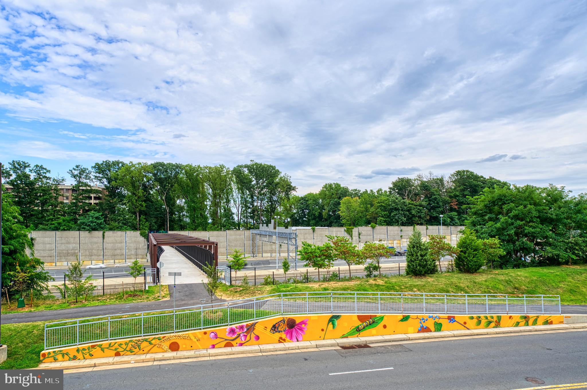 1800 Old Meadow Road, Unit 1006 McLean, VA 22102 - Photo 57 of 63 a view of swimming pool with a garden