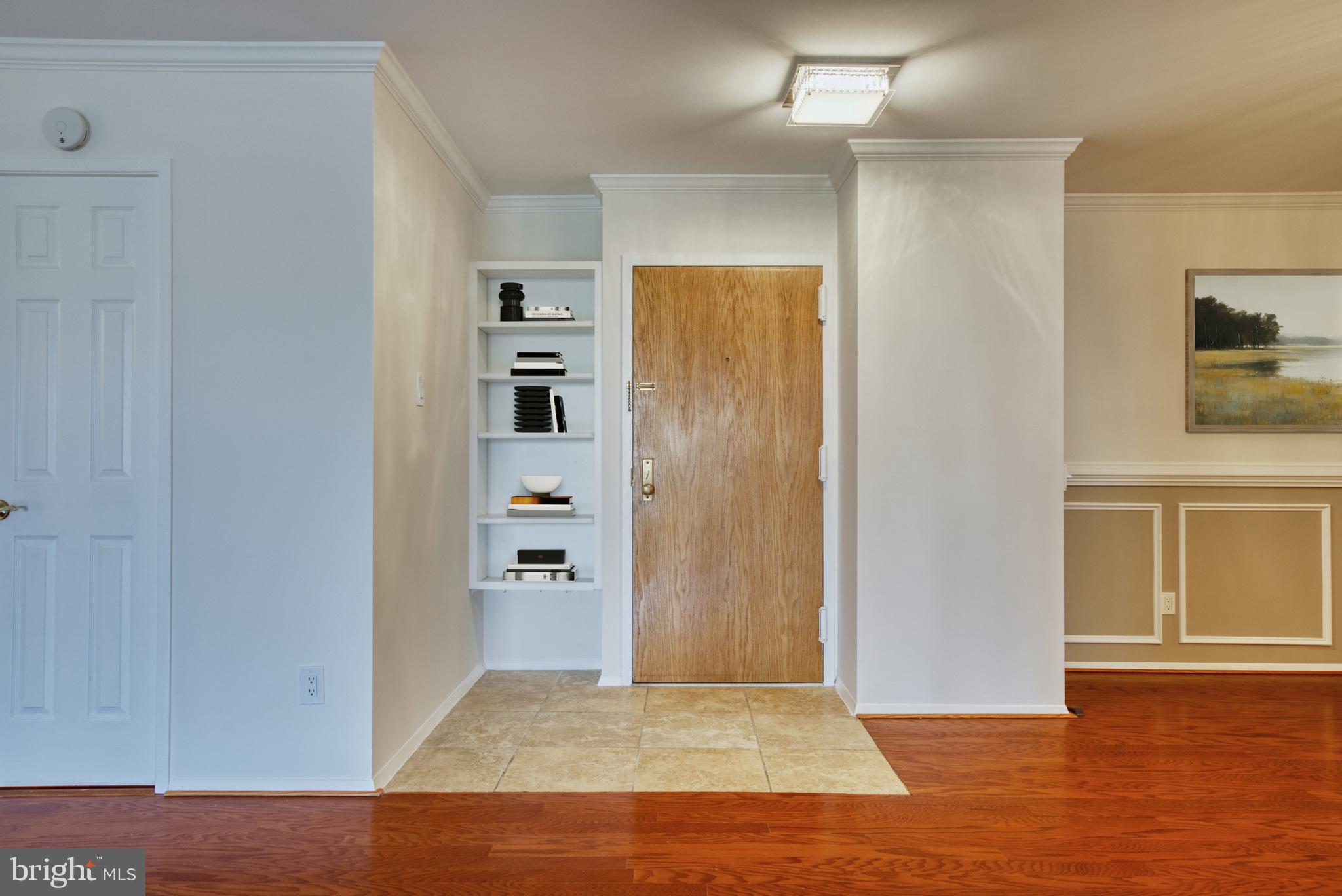 1800 Old Meadow Road, Unit 1006 McLean, VA 22102 - Photo 9 of 63 an empty room with wooden floor closet and windows