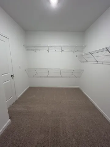 a view of a room with racks on the wall