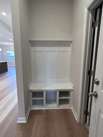 a view of a room with window and wooden floor