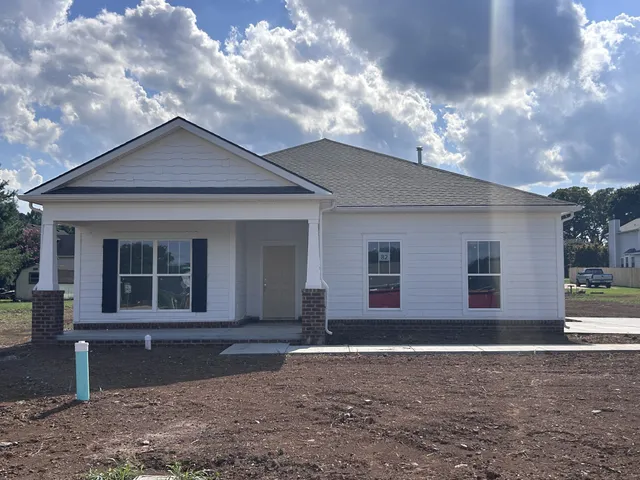 a front view of a house with yard