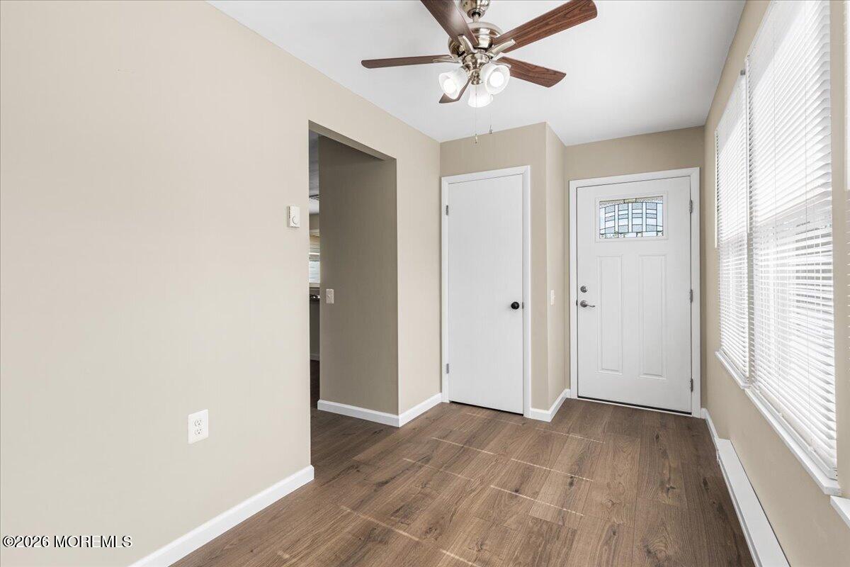 16 D Spring Street, Unit 50 Whiting, NJ 08759 - Photo 5 of 28 a view of a hallway with wooden floor and closet area