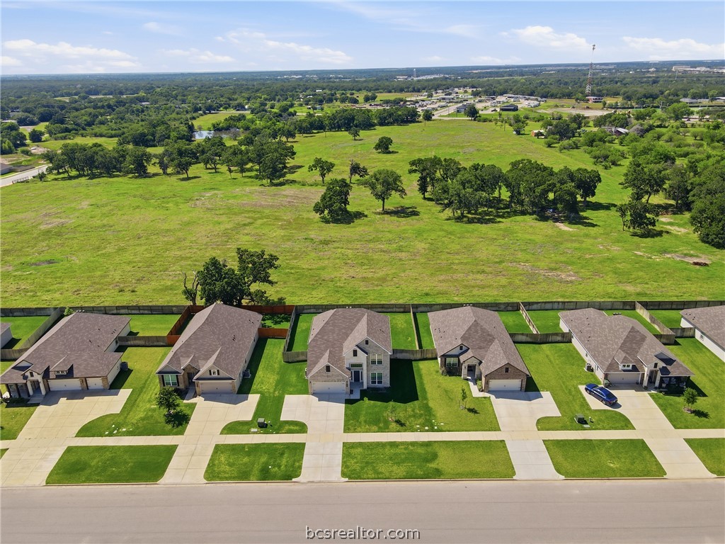 1922 Viva Road Bryan, TX 77807 - Photo 3 of 45 Stunning aerial perspective showcasing rare privacy with no rear neighbors and ranch views behind the home.