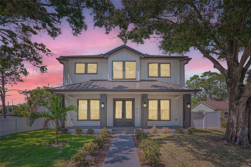 325 33rd Avenue North St. Petersburg, FL 33704 - Photo 2 of 57 a front view of a house with garden