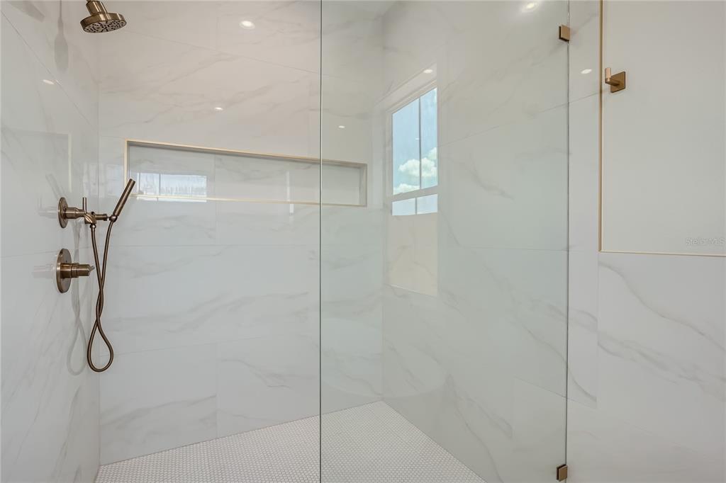325 33rd Avenue North St. Petersburg, FL 33704 - Photo 26 of 57 a bathroom with a glass shower door
