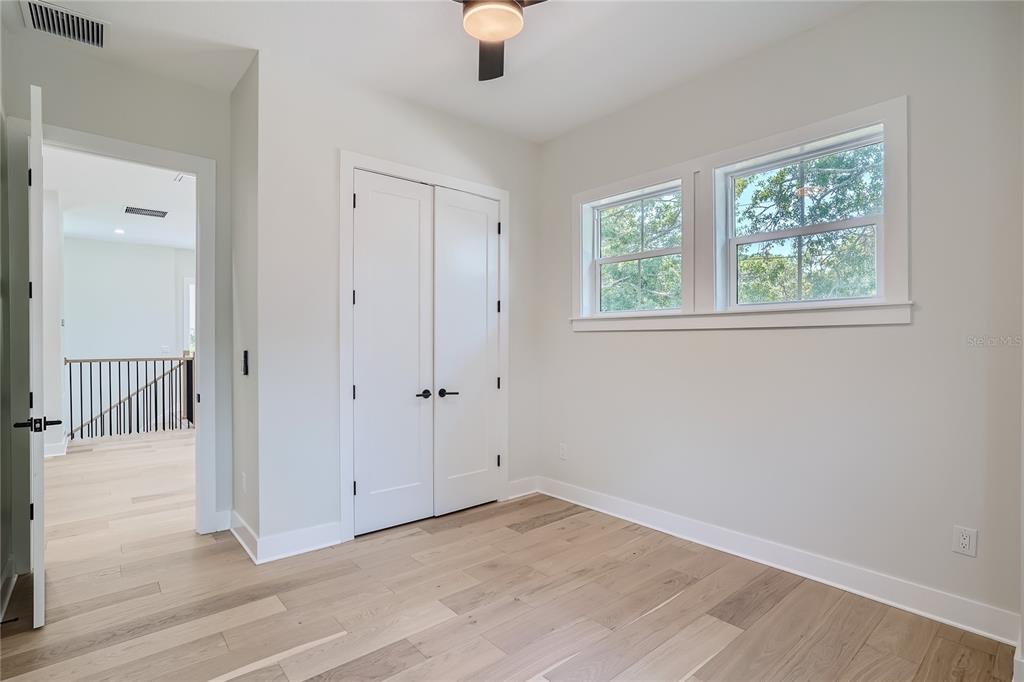 325 33rd Avenue North St. Petersburg, FL 33704 - Photo 31 of 57 a view of an empty room with wooden floor and a window