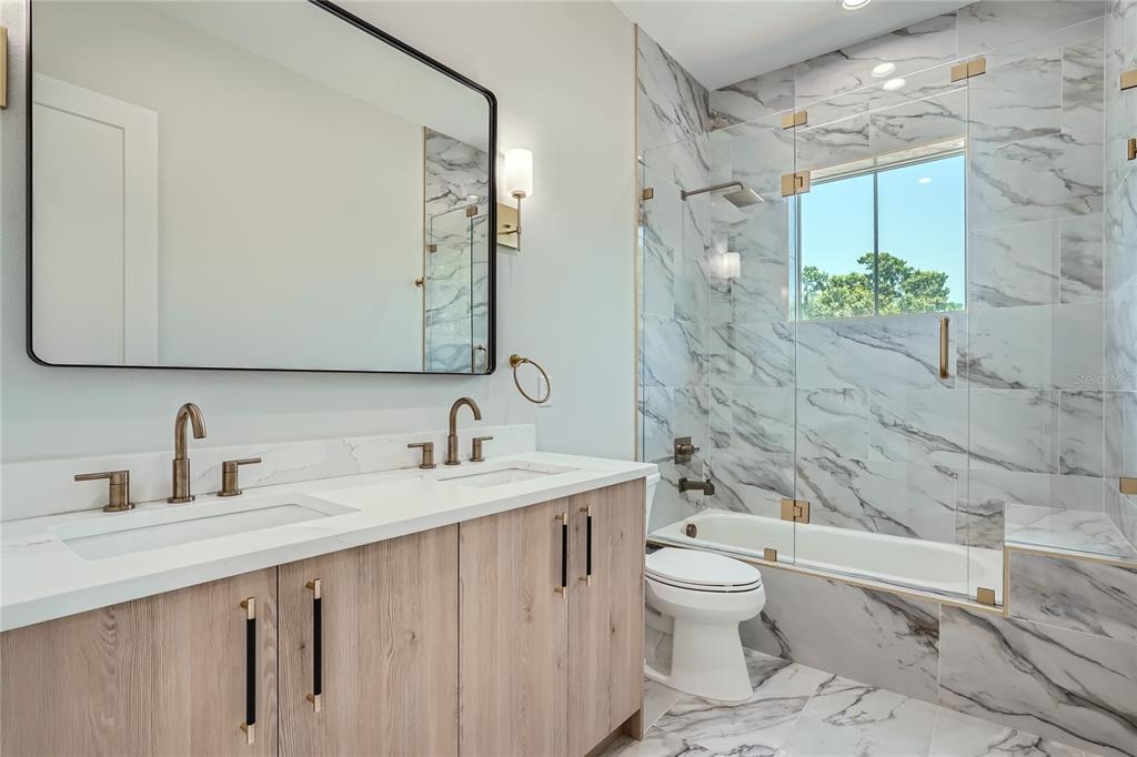 325 33rd Avenue North St. Petersburg, FL 33704 - Photo 33 of 57 a bathroom with a sink a toilet and shower