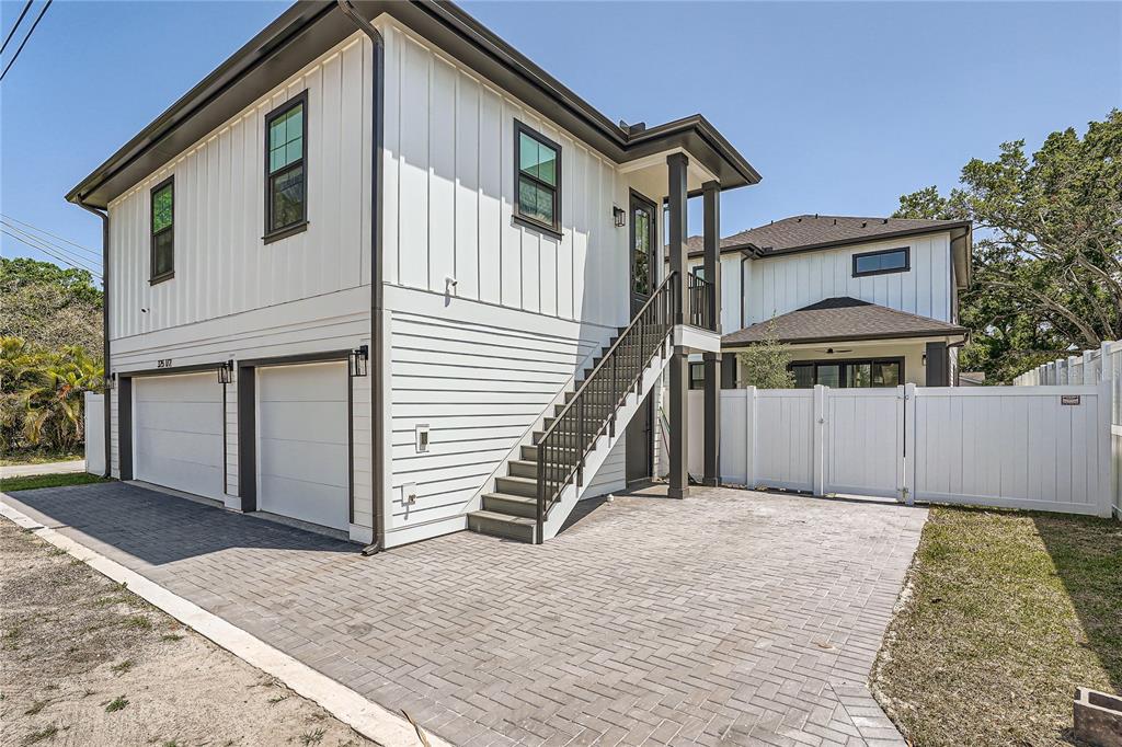 325 33rd Avenue North St. Petersburg, FL 33704 - Photo 41 of 57 a front view of a house with a yard and garage