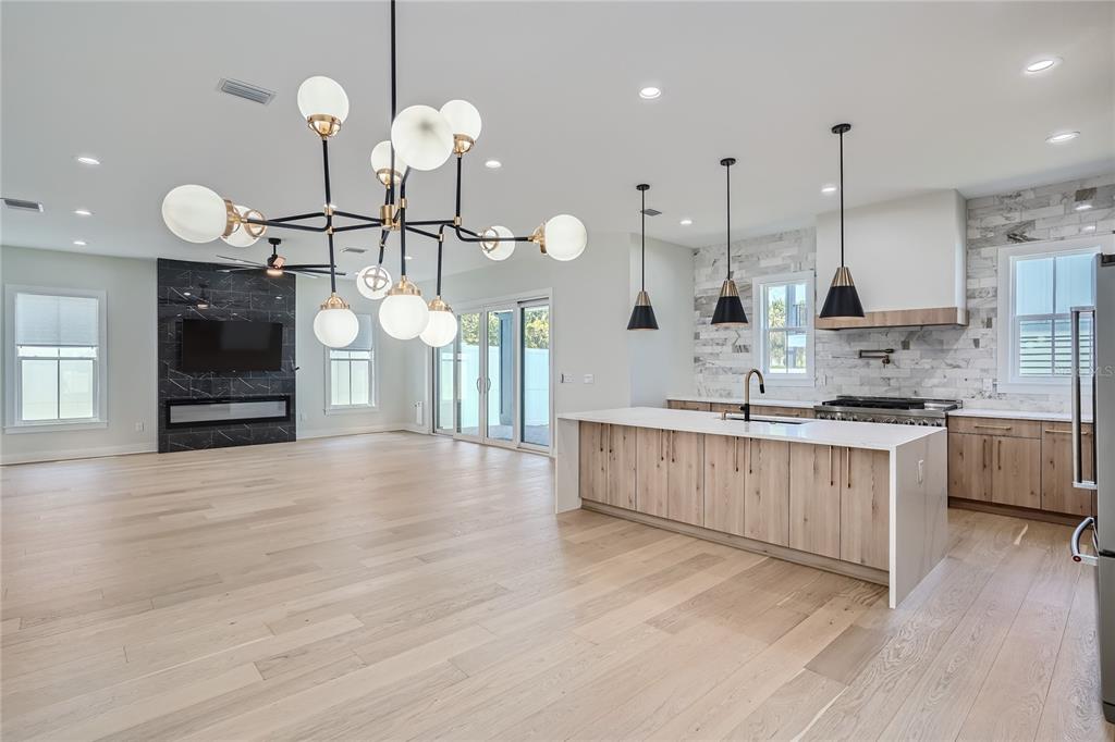 325 33rd Avenue North St. Petersburg, FL 33704 - Photo 5 of 57 a kitchen with kitchen island a sink stainless steel appliances and cabinets