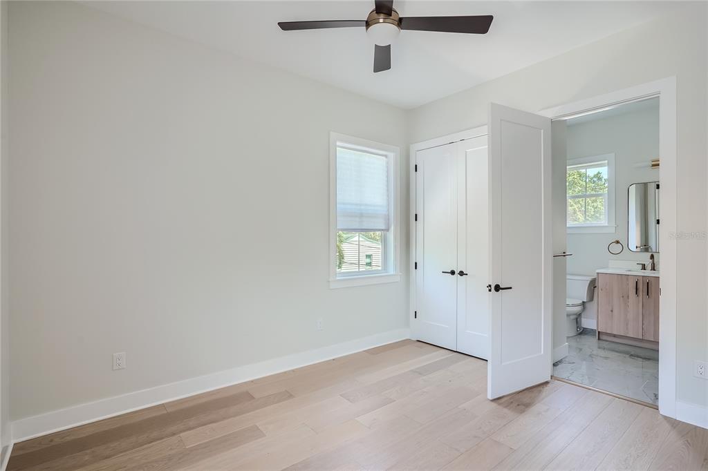 325 33rd Avenue North St. Petersburg, FL 33704 - Photo 52 of 57 an empty room with a cabinet and mirrors