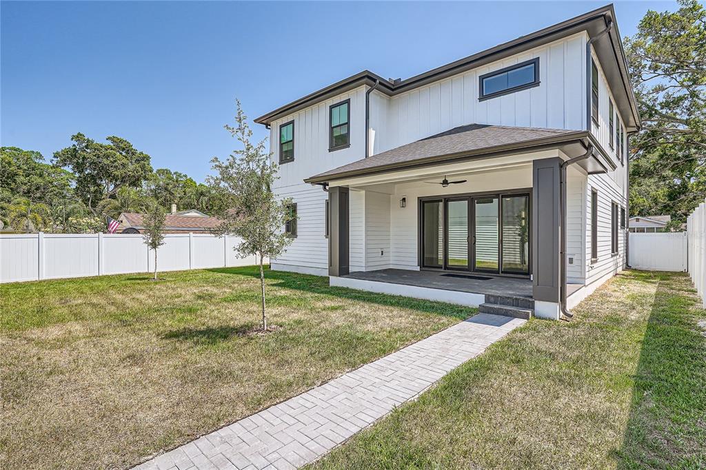 325 33rd Avenue North St. Petersburg, FL 33704 - Photo 55 of 57 a view of a house with a backyard and a tree