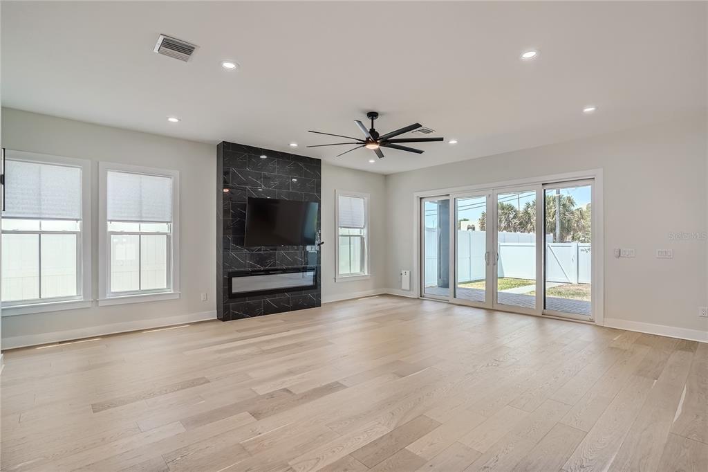 325 33rd Avenue North St. Petersburg, FL 33704 - Photo 7 of 57 a view of an empty room with a window and a kitchen
