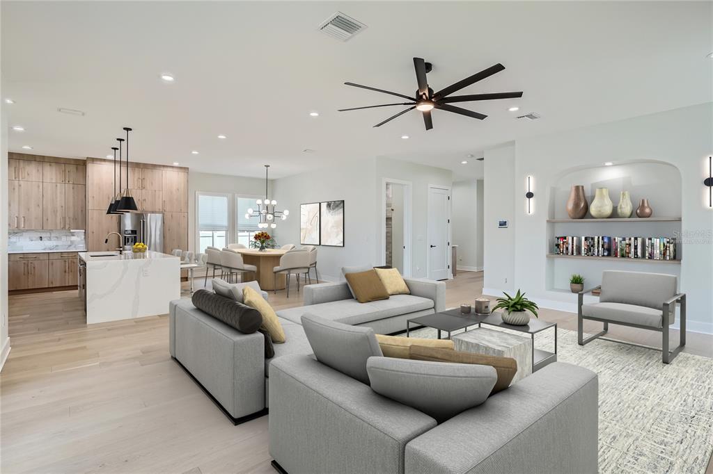 325 33rd Avenue North St. Petersburg, FL 33704 - Photo 8 of 57 a living room with furniture kitchen view and a chandelier