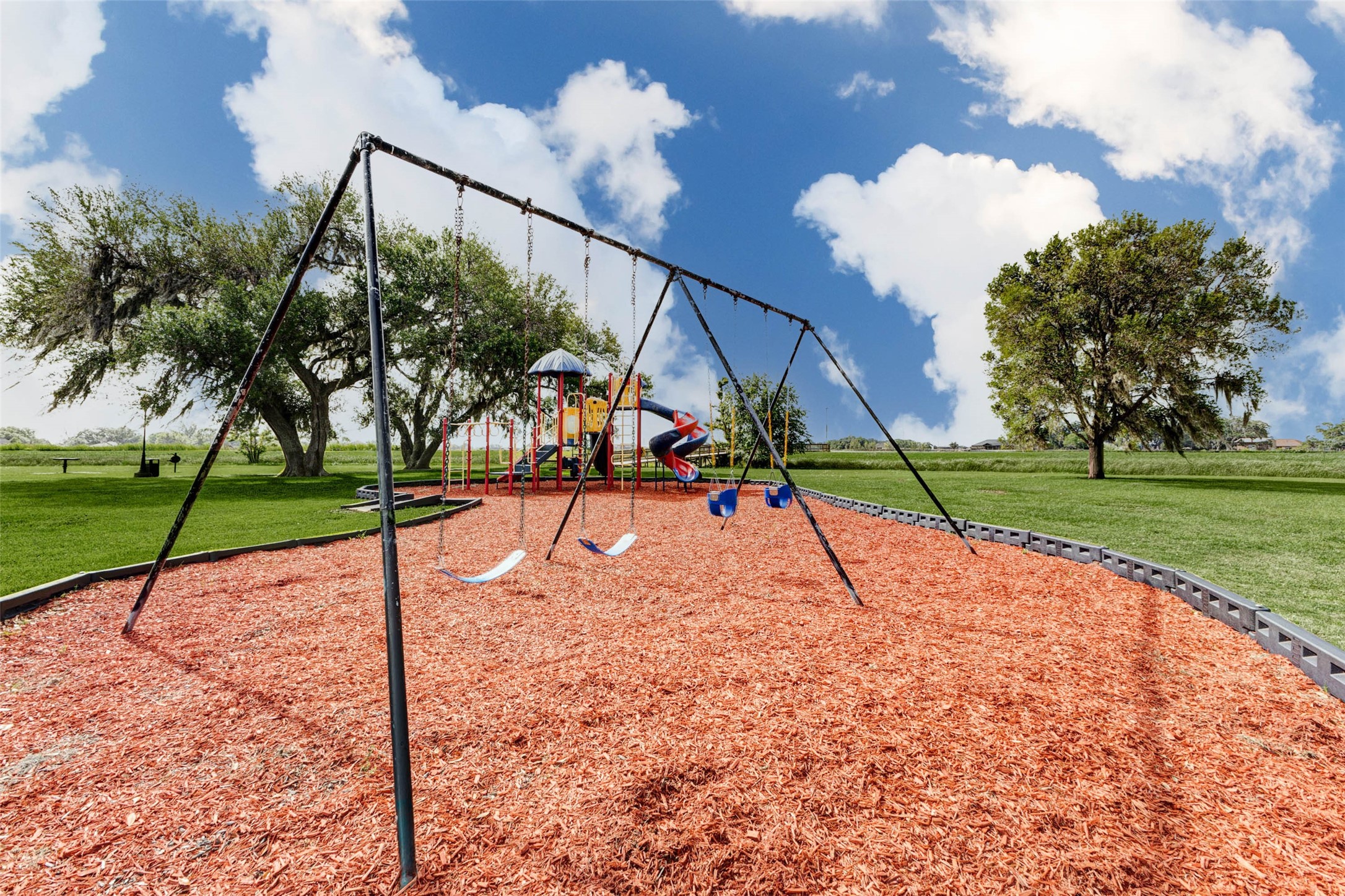 913 Buffalo Trail Angleton, TX 77515 - Photo 10 of 17 a view of park with swings