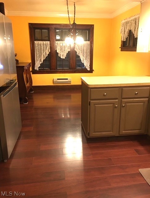 9124 Snow Road Cleveland, OH 44130 - Photo 7 of 23 Kitchen with gray cabinetry, stainless steel fridge, an inviting chandelier, dark hardwood / wood-style floors, and decorative light fixtures
