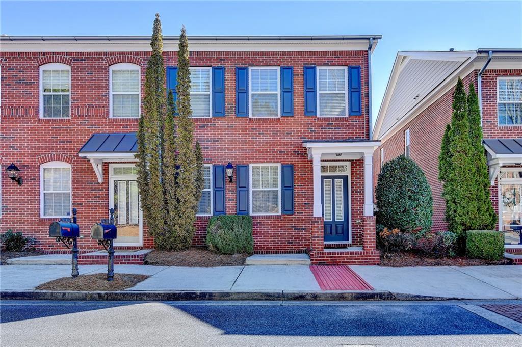 4133 Stonecypher Road Suwanee, GA 30024 - Photo 1 of 1 front view of a brick house with a yard