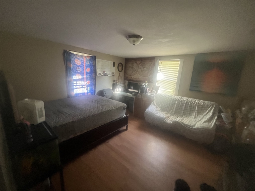 643 West Street Gardner, MA 01440 - Photo 5 of 10 a bedroom with a bed window and lamp