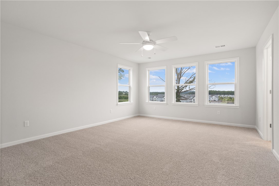 631 Sweetspire Trail, Unit 148 Seneca, SC 29678 - Photo 15 of 36 A spacious and inviting room features plentiful windows, offering serene neighborhood views and soft natural illumination.