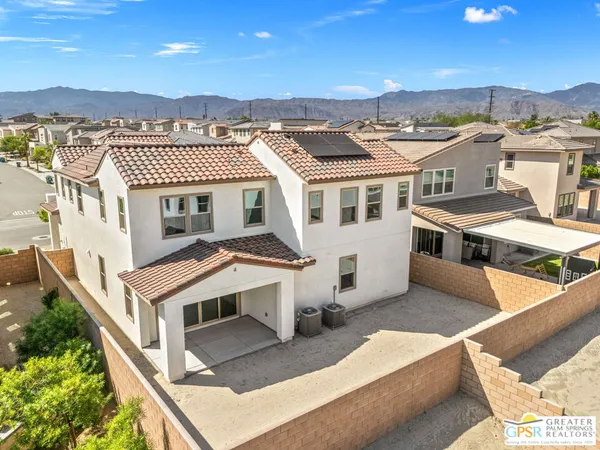 an aerial view of a house with a balcony