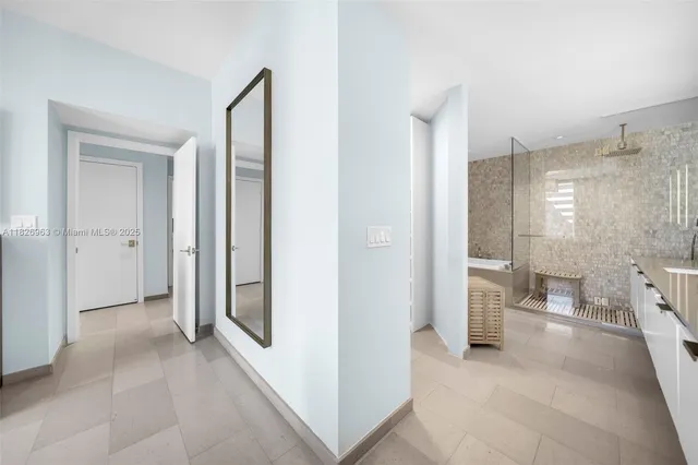 a view of a bathroom with a tub and shower