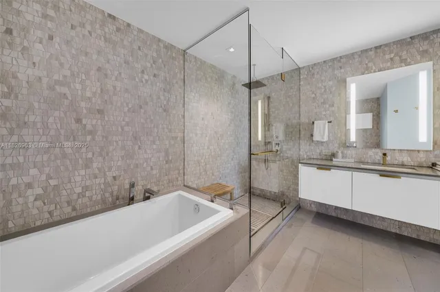 a bathroom with a bathtub and a sink