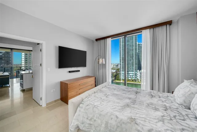 a view of a livingroom with furniture and a flat screen tv