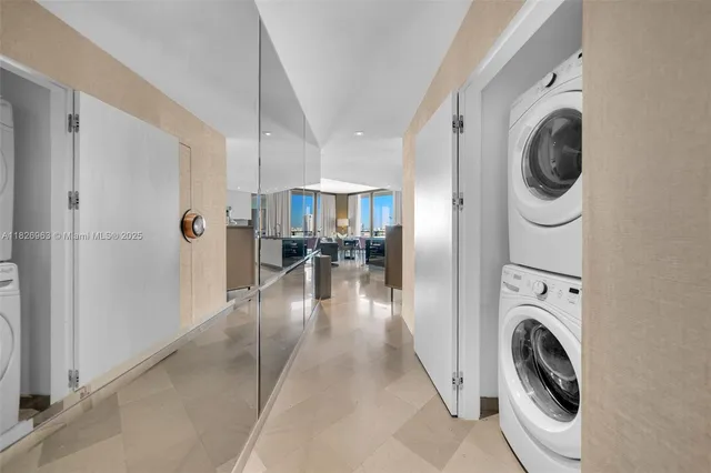 a view of a hallway with washer and dryer
