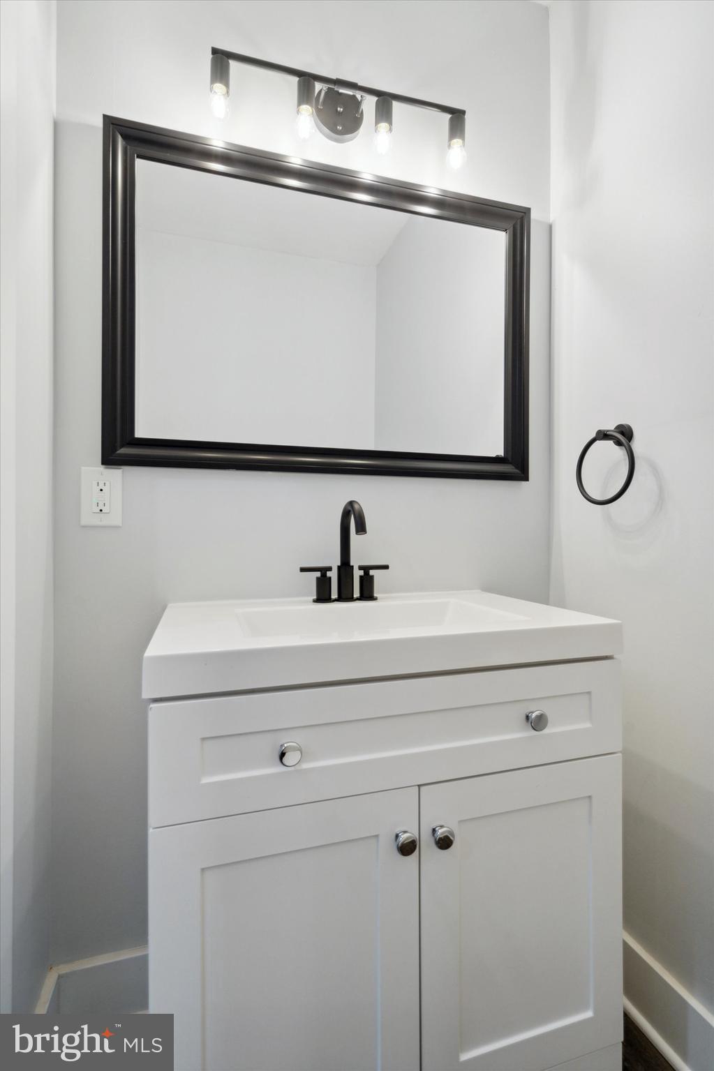2358 East York Street Philadelphia, PA 19125 - Photo 6 of 15 a bathroom with a sink and mirror