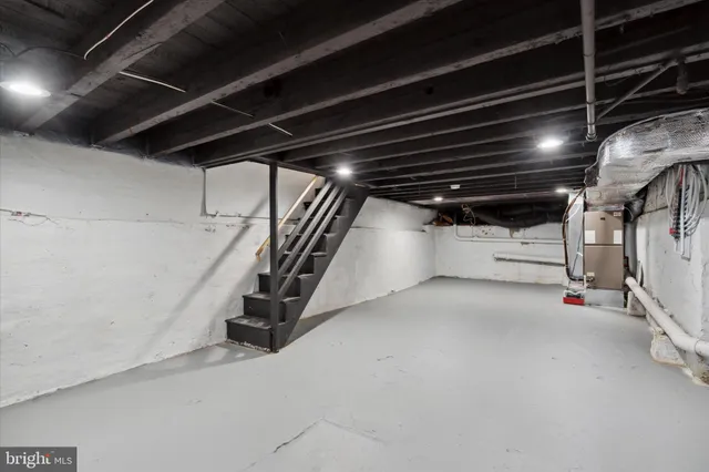 a view of empty room with wooden ceiling