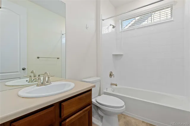 a bathroom with a sink a toilet and a bathtub