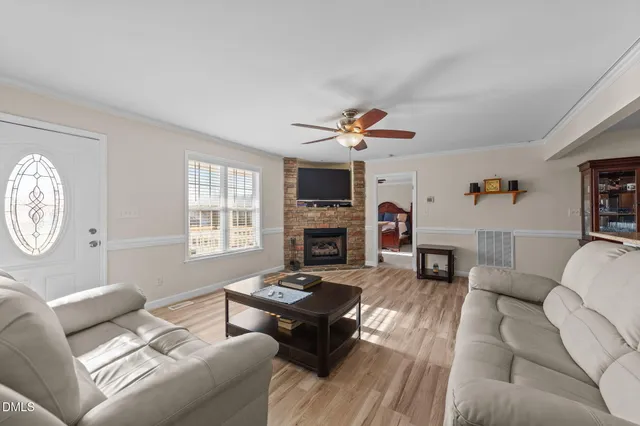 a living room with furniture and a fireplace