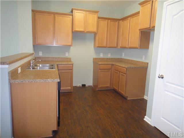 4304 Hargrove Road Raleigh, NC 27604 - Photo 3 of 10 a utility room with sink dryer and washer