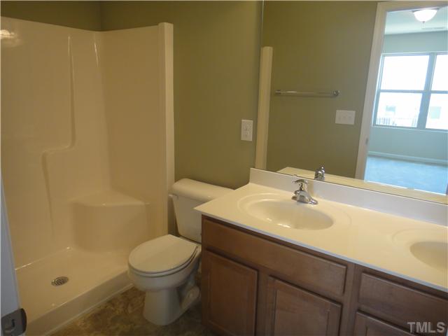 4304 Hargrove Road Raleigh, NC 27604 - Photo 6 of 10 a bathroom with a sink a toilet and shower
