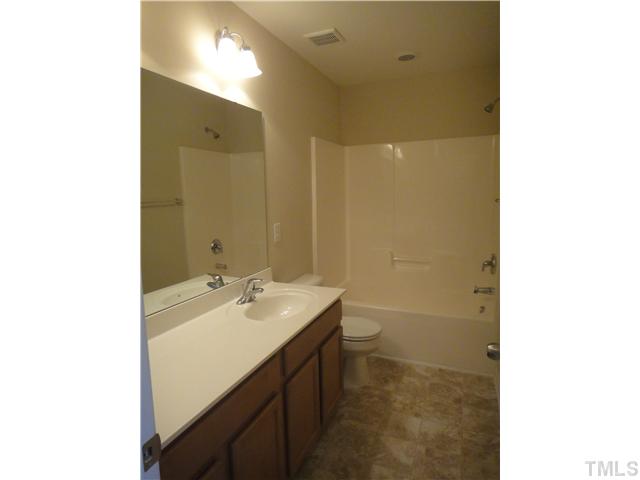 4304 Hargrove Road Raleigh, NC 27604 - Photo 9 of 10 a bathroom with a sink a toilet and shower