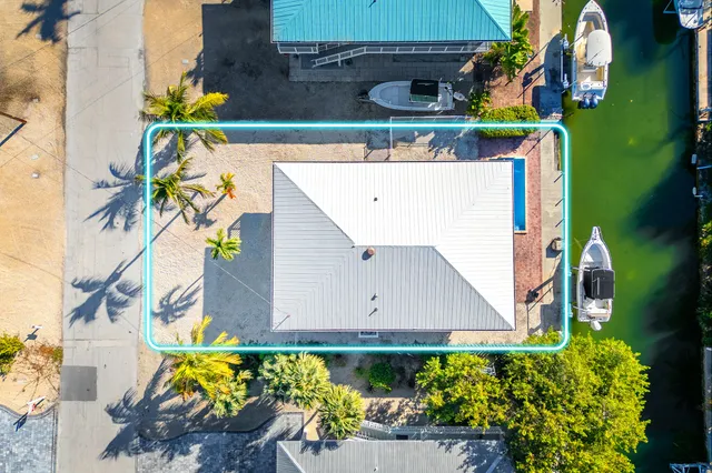 an aerial view of a house with a outdoor space